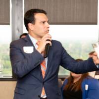 male speaker with microphone close up